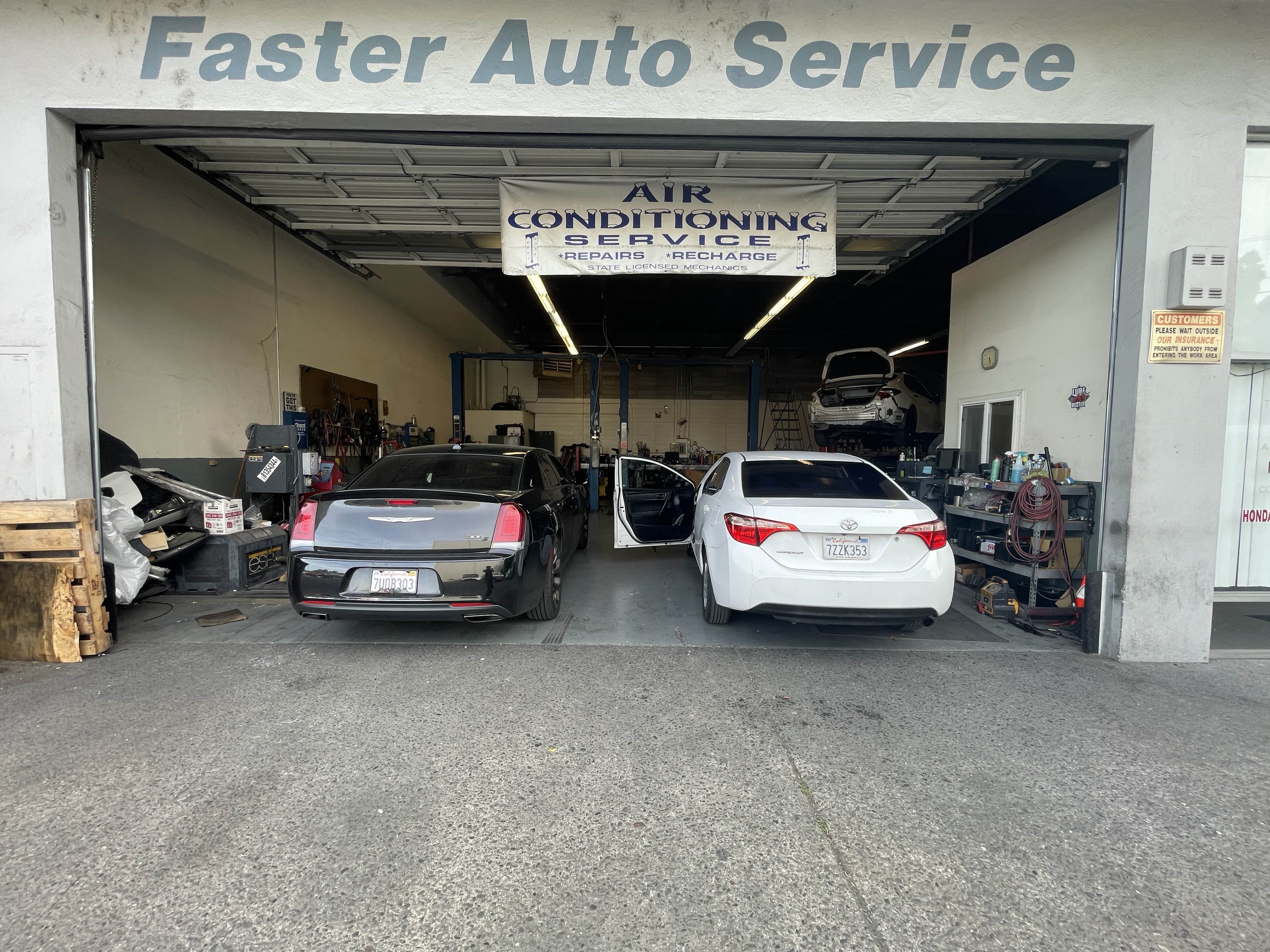 Faster Auto Service shop interior with cars being serviced